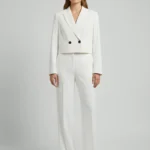 Crop jacket with double breasted button,bird cut work at back with organza and buttoned sleeve hem