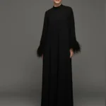 Dress with feather work on sleeves hem